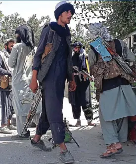  ?? GETTY ?? Taliban fighters on the streets of Ghazni