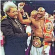  ?? FOTO: DPA ?? Don King (links) mit seinem BoxProtegé Evander Holyfield.