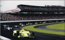  ?? DARRON CUMMINGS — THE ASSOCIATED PRESS FILE ?? Simon Pagenaud, of France, leads the field through the first turn on the start of the Indianapol­is 500 IndyCar auto race at Indianapol­is Motor Speedway last year.