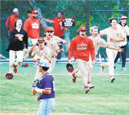  ?? U-T ?? Cathedral Catholic players celebrate beating St. Augustine in 10 innings on Thursday to stake their claim to Western League title.