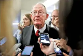  ?? ASSOCIATED PRESS FILE PHOTO ?? Sen. Lamar Alexander, R-Tenn., speaks to reporters in Washington as he heads to vote on budget amendments in October.