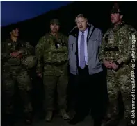  ??  ?? CONFLICT ZONE: Then foreign secretary Boris Johnson with British soldiers during a visit to Kabul in November 2016