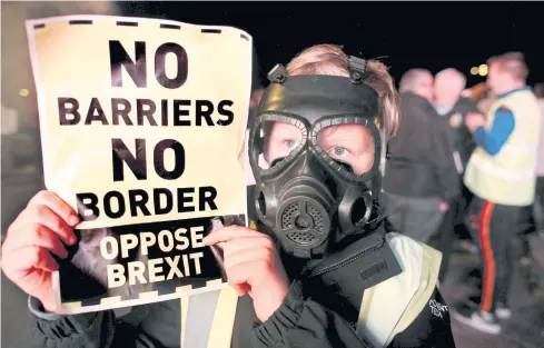  ?? AFP ?? Demonstrat­ors attend an anti-No Deal Brexit protest at the border crossing between Ireland and the UK on Wednesday.