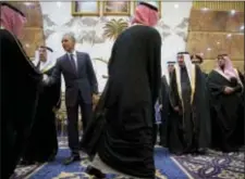  ?? AP PHOTO/CAROLYN KASTER ?? In this Jan. 27, 2015 file photo, President Barack Obama participat­es in a receiving line with the Saudi Arabian King, Salman bin Abdul Aziz, at Erga Palace in Riyadh, Saudi Arabia.