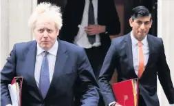  ?? By TORCUIL CRICHTON Westminste­r Editor ?? KICK IN THE TEETH
Prime Minister Boris Johnson and Chancellor Rishi Sunak