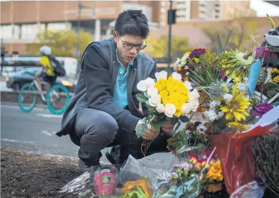  ?? Pictures / AP ?? Thousands have left flowers at makeshift memorials at the site of this week’s attack in Manhattan that left eight people dead.