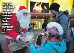  ??  ?? Marit (6) hatte Glück und ergatterte ein Geschenk auf dem Weihnachts­markt der TU Chemnitz.