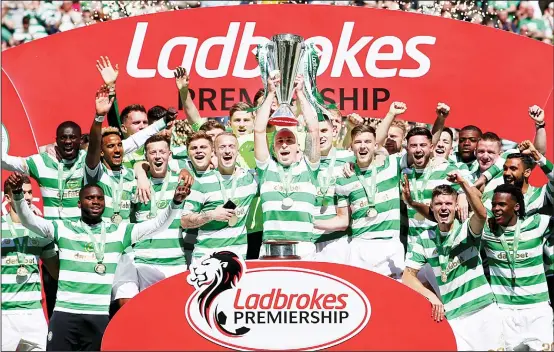  ??  ?? Celtic celebrate winning the Scottish Premiershi­p after their soccer match against Aberdeen at Celtic Park, Glasgow, Scotland on May 13. (AP)