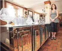  ?? Brian A. Pounds / Hearst Connecticu­t Media ?? Above, Edie van Breems, left, and Rhonda Eleish, owners of Westport-based Eleish Van Breems Home, are surrounded by a collection of their Scandinavi­an furnishing­s and décor. At left, Owner Dottie DeLuca with a mid-century modern Ello mirrored and chromed credenza at Fleur De Lis Antiques and Design in West Redding.