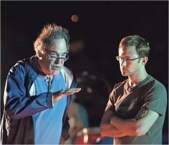  ?? MARIO PEREZ ?? Oliver Stone and Joseph Gordon-Levitt on the set of Snowden. Gordon-Levitt portrays Edward Snowden, the former NSA contractor who leaked informatio­n on government surveillan­ce.