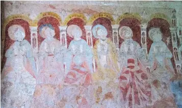  ?? — PHOTOS: THE ASSOCIATED PRESS ?? A painting of six of Christ’s Apostles, on the wall of the chancel of St Mary’s Church. The tiny church dates back to around 1130 AD.