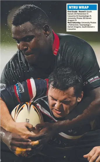  ?? Picture: HELEN ORR ?? South Darwin’s Hamish Riley wrestling Palmerston opponent Jordon Simshauser to the ground during NTRU premiershi­p action at Marrara’s Rugby Park last night