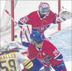  ?? CP PHOTO ?? Boston Bruins forward Tim Schaller (59) scores a goal against Montreal Canadiens goalie Zach Fucale as defenceman Jeff Petry defends during second period action of an NHL preseason game in Quebec City on Sept. 18.