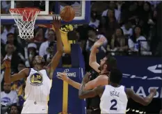  ??  ?? Golden State Warriors forward Kevin Durant (35) blocks a shot by Cleveland Cavaliers forward Kevin Love (0) during the second half of an NBA basketball game in Oakland on Monday. The Warriors won 99-92. AP PHOTO/TONY AVELAR