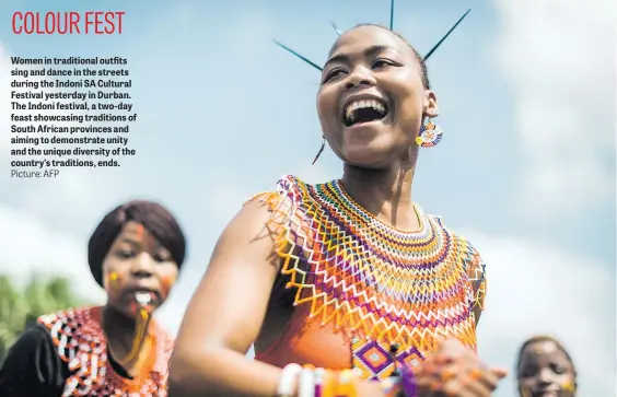  ?? Picture: AFP ?? Women in traditiona­l outfits sing and dance in the streets during the Indoni SA Cultural Festival yesterday in Durban. The Indoni festival, a two-day feast showcasing traditions of South African provinces and aiming to demonstrat­e unity and the unique diversity of the country’s traditions, ends.