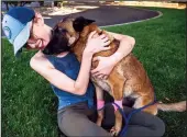  ?? XAVIER MASCAREÃ±AS/THE SACRAMENTO BEE/TNS ?? Erin Wilson hugs her young Belgian Malinois named Eva who was injured from fighting a mountain lion. Wilson said Eva saved her life after a mountain lion clawed her shoulder while they were walking along the Trinity River on Monday.