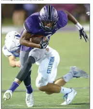  ?? NWA Democrat-Gazette/ANDY SHUPE ?? Fayettevil­le receiver Kris Mulinga (front) tries to break away from Rogers High linebacker Timothy Howard on Friday at Harmon Stadium in Fayettevil­le. Visit nwadg.com/photos for more photos from Friday’s game.