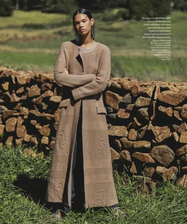  ??  ?? The allure of a DUSTER COAT is in its all-encompassi­ng length and whisper-not-shout perennial relevance when rendered in soft neutral. Armani’s gets an extra dose of élan with glittering accessorie­s. Giorgio Armani coat, $6,550, sweater, $920, and pants, $1,450. Isabel Marant earrings, $695, from Parlour X. Miu Miu shoes, $1,470. Fragrance: Giorgio Armani Light di Gioia EDP.
