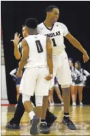  ?? CHRISTIAN K. LEE/ LAS VEGAS REVIEWJOUR­NAL / @CHRISKLEE_JPEG ?? Findlay Prep’s P.J. Washington (1) celebrates with Justin Roberts during the Pilots’ 78-72 overtime victory over Bishop Gorman in the Big City Showdown on Saturday at South Point Arena. Washington had 25 points and 14 rebounds.