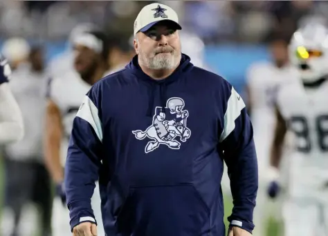  ?? Andy Lyons/Getty Images ?? Cowboys head coach Mike McCarthy, a Bishop Boyle grad, walks on the field before the game Thursday against the Titans at Nissan Stadium in Nashville, Tenn. See the final results of the game on Page C-8.