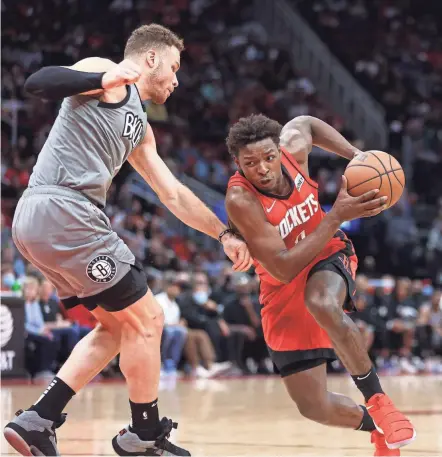  ?? TROY TAORMINA/USA TODAY SPORTS ?? "Jae'sean is what you build a team around. He's what you call a culture guy, and he's a great asset to our team," Rockets assistant John Lucas said of Jae'sean Tate (right).