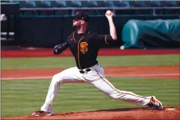  ?? PHOTO BY CARMEN MANDATO — GETTY IMAGES ?? San Francisco Giants’ Alex Wood saw a spine specialist in Arizona on Monday after dealing with back stiffness for the last several days.