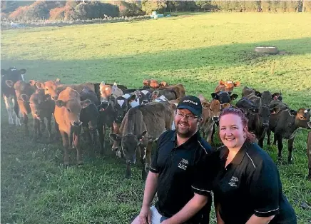  ?? SUPPLIED ?? Glen and Trish Rankin with their cows on the farm they share milk on in Mangamuka.