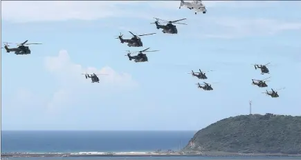  ?? PICTURE: LEON LESTRADE ?? FLY BY: A massed helicopter formation made up of BK117s, AgustaWest­land AW109s, Oryxes and Rooivalk heads for the headland of the Bluff.