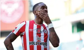  ?? ?? Ivan Toney, wearing a shirt emblazoned with the logo of a betting firm, on a pitch surrounded by gambling ads. Photograph: Nigel French/PA