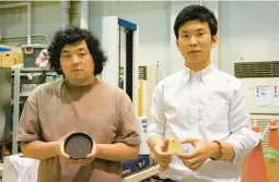  ?? CHISATO TANAKA/AP ?? Tokyo University researcher­s Kota Machida, left, and Yuya Sakai display samples of“food cement” made using food waste at their laboratory last month.