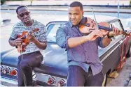  ?? PHOTO BY COLIN BRENNAN ?? Black Violin, the string duo of Kevin Sylvester and Wilner Baptiste, are doing shows in Santa Fe and Las Vegas, N.M., starting Thursday.