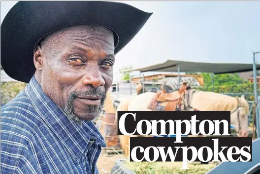  ?? AP PHOTO/RICHARD VOGEL ?? Ivory McCloud poses for a photo with his horse, Diamond, at his stable in the backyard of a home in Compton, Calif., on Aug. 7.