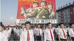  ?? KIM WON- JIN / AFP / GETTY IMAGES ?? A poster at a rally in Pyongyang on Wednesday in support of North Korea’s stance against the U. S.