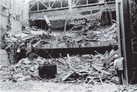  ?? FILES ?? A crew takes a break from demolition work at the Majestic Theatre at 20 West Hastings on May 23, 1967. If you look closely, workers can be seen sitting on the lip of the balcony. Built as the Pantages Theatre in 1917, the venue hosted such entertaine­rs...