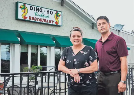  ?? PHOTOS BY FRED SQUILLANTE/COLUMBUS DISPATCH ?? Ding Ho, a Cantonese restaurant on the West Side, has been open since 1956, making it one of Columbus’ oldest restaurant­s. The restaurant has been owned by the same family, and its current owners, twins Lucy and Steve Yee (pictured) are the third generation of owners.