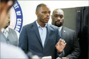  ?? AP PHOTO/ANGIE WANG, FILE ?? FILE - In this June 5, 2017, file photo, Arizona state Democratic Rep. Reginald Bolding Jr., left, calls on Gov. Doug Ducey to remove six confederat­e monuments in Arizona during a news conference by the NAACP and Black Lives Matter in Phoenix, Ariz....