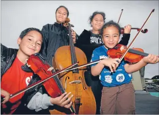  ?? Photos: MAARTEN HOLL ?? Family affair: Four Tamaiva brothers and sisters who play together at the kids and community orchestra, from left, Francois, 9, violin, Tiare, 14, cello, Erana, 11, violin, and Lina, 5, violin.