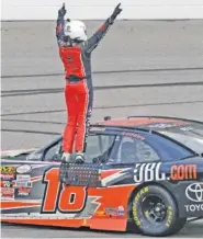  ?? THE ASSOCIATED PRESS ?? Christophe­r Bell celebrates winning Saturday’s NASCAR Xfinity Series race at Kansas Speedway.