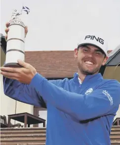  ??  ?? 0 Liam Johnston with the Scottish Open Stroke Play trophy.