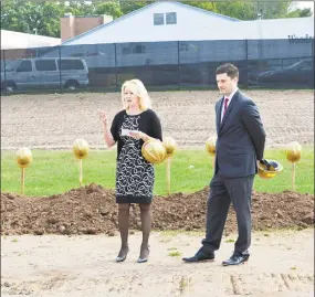  ?? Hearst Connecticu­t Media file photo ?? Common Council Deputy Majority Leader Mary Bartolotta, chairwoman of the middle school building committee, and Christophe­r Drake, chairman of the Board of Education, take part in the ceremonial groundbrea­king for the new Woodrow Wilson Middle School in Middletown.