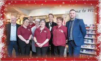  ??  ?? Dermot and Siobhan Walsh with staff at Walsh’s SuperValu,Cahersivee­n.