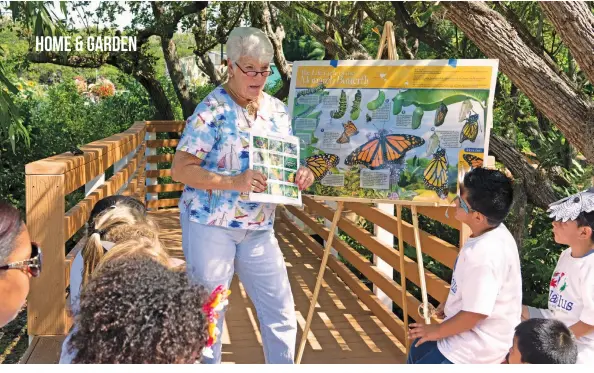  ??  ?? A group of students visiting Shell Point’s butterfly habitat learn about the winged creatures from Shell Point resident and volunteer Lynda Freisner.