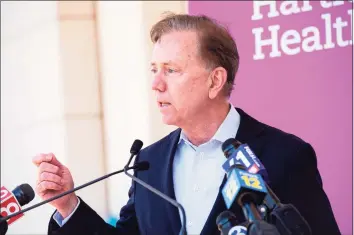  ?? Joseph Prezioso / Getty Images ?? Gov. Ned Lamont said he had little discretion over how the initial pandemic relief was spent, but he did not challenge the authority of lawmakers to set spending priorities in the state budget.