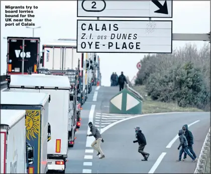  ?? Picture: STEVE REIGATE ?? Migrants try to board lorries bound for the UK near the port of Calais