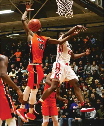  ?? | ALLEN CUNNINGHAM/ FOR THE SUN- TIMES ?? Bolingbroo­k’s Tyler Cochran ( 23) comes up with a big block against Romeoville’s Dontia Johnson.