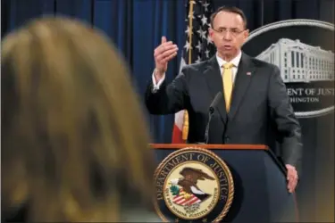  ?? JACQUELYN MARTIN — THE ASSOCIATED PRESS ?? Deputy Attorney General Rod Rosenstein answers a question after announcing that the office of special counsel Robert Mueller announced a grand jury has charged 13Russian nationals and several Russian entities, Friday in Washington. The defendants with...