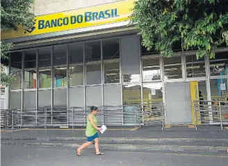  ?? DANIEL TEIXEIRA/ESTADÃO–27/2/2014 ?? Fatores. Lucro do banco foi garantido com margens financeira­s e receitas com serviços