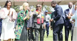  ?? ?? President Mnangagwa jokingly apologises to journalist­s after kicking the ball in their direction while flanked by Sports, Recreation, Arts and Culture Minister Kirsty Coventry, Deputy Minister Emily Jesaya (left) and PHD Ministries leader Prophet Walter Magaya (right) during the official commission­ing of The Heart Stadium in Waterfalls yesterday