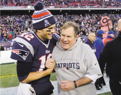  ?? Charles Krupa / Associated Press 2014 ?? Patriots quarterbac­k Tom Brady and head coach Bill Belichick are the longest-tenured such duo in NFL history, preparing to wrap up their 18th season together. They’re in their eighth Super Bowl together, going 5-2 so far.