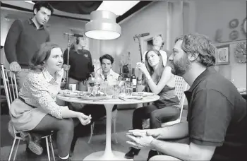  ?? By Jojo Whilden, HBO ?? Table talk: Judd Apatow works with creator/star Lena Dunham, left, and co-stars Alex Karpovsky, Chris Abbott and Allison Williams on a scene for Girls.